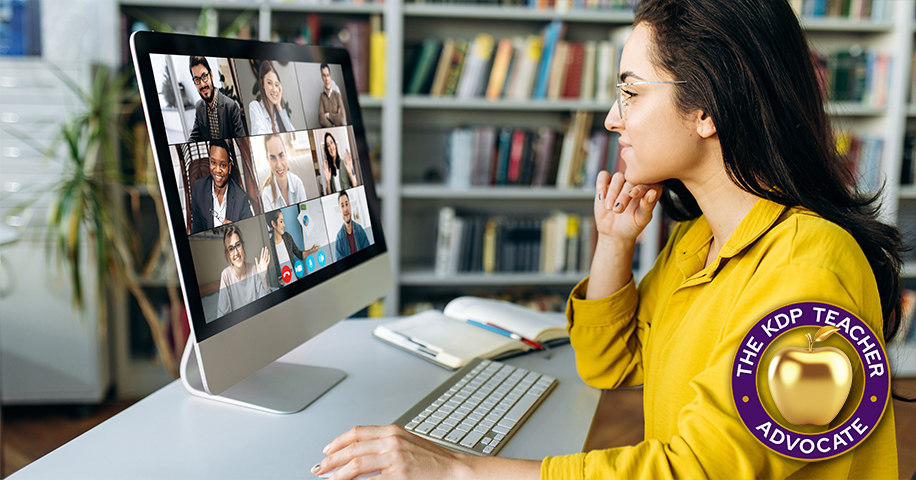 Woman working at computer with conference call